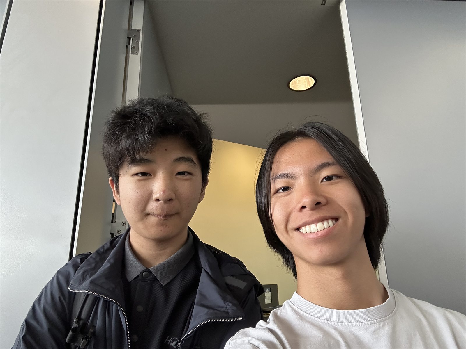 Jalen and a friend in a selfie in a doorway at MIT on Zero Robotics field day