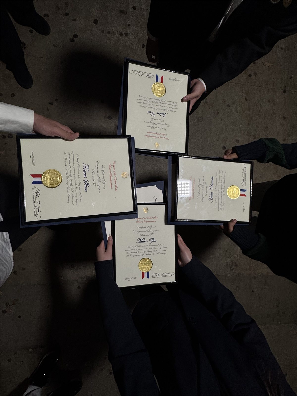 Four framed Certificates of Special Congressional Recognition held together in a circle, one made out to Jalen Cai